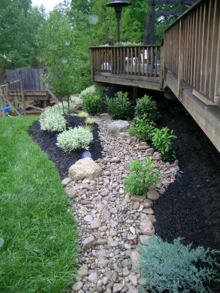 raised deck landscaped with native rocks and plants